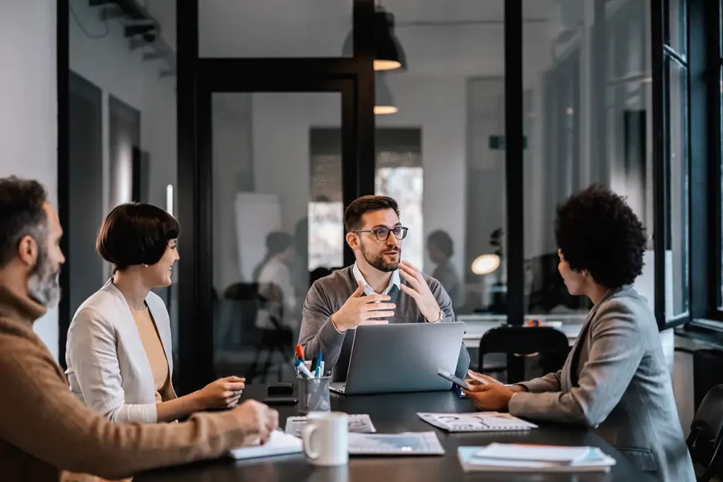 A group of people at a table discussing business